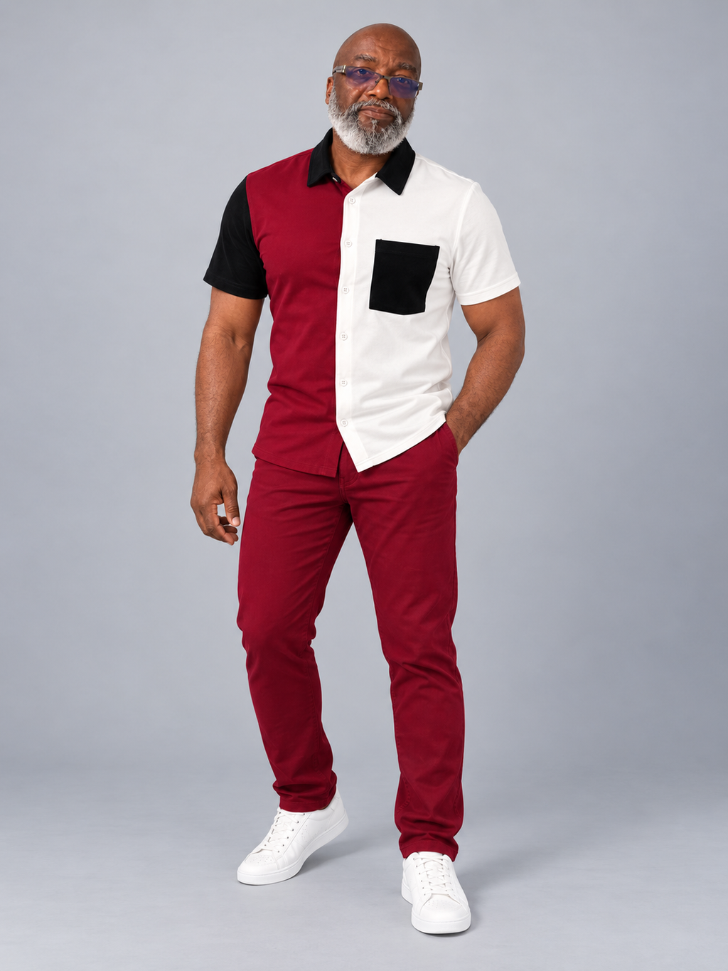 Model wearing burgundy white and black color block short sleeve shirt with matching burgundy trousers