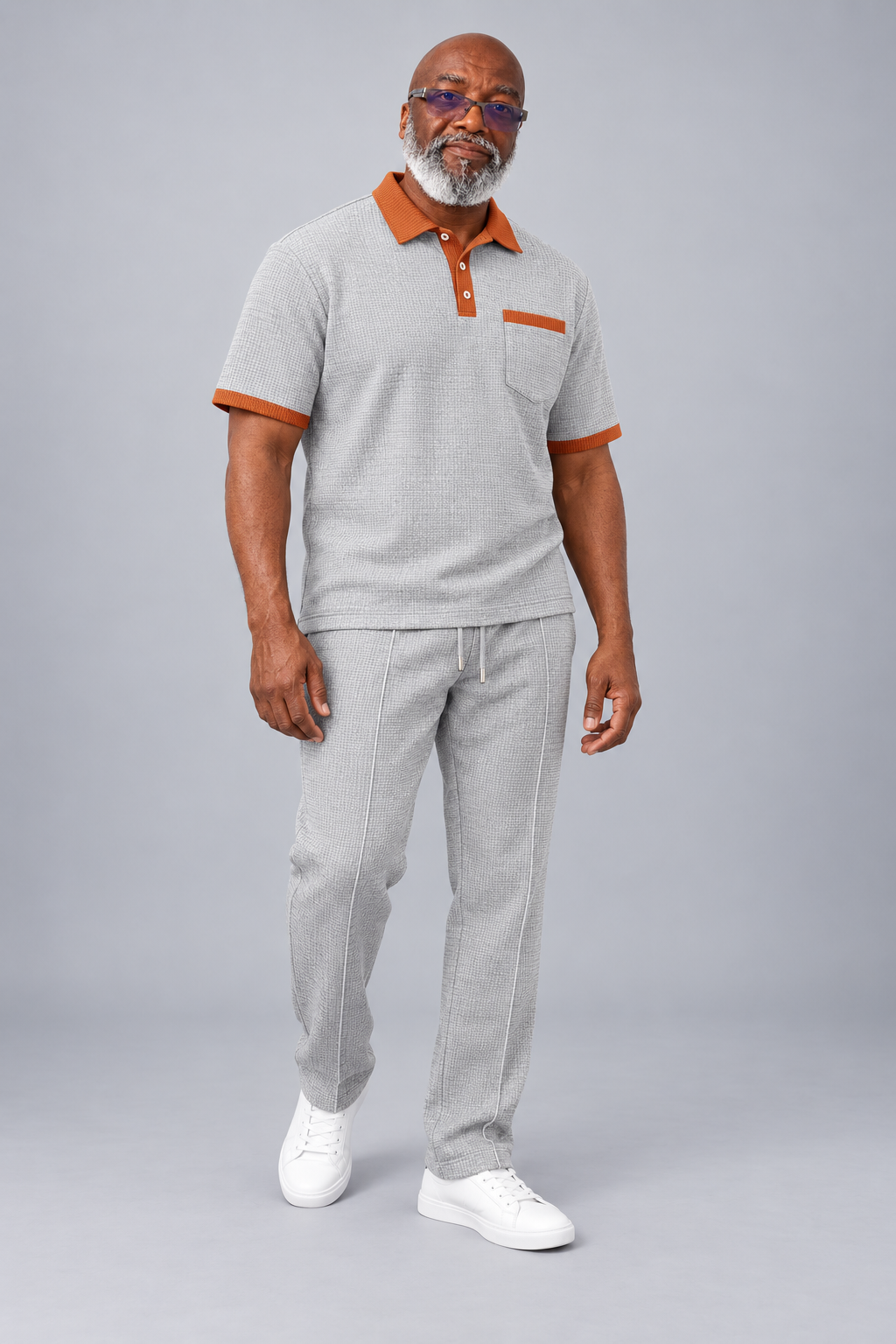Model wearing the grey Men's Waffle Knit Lapel Casual Set with orange trim